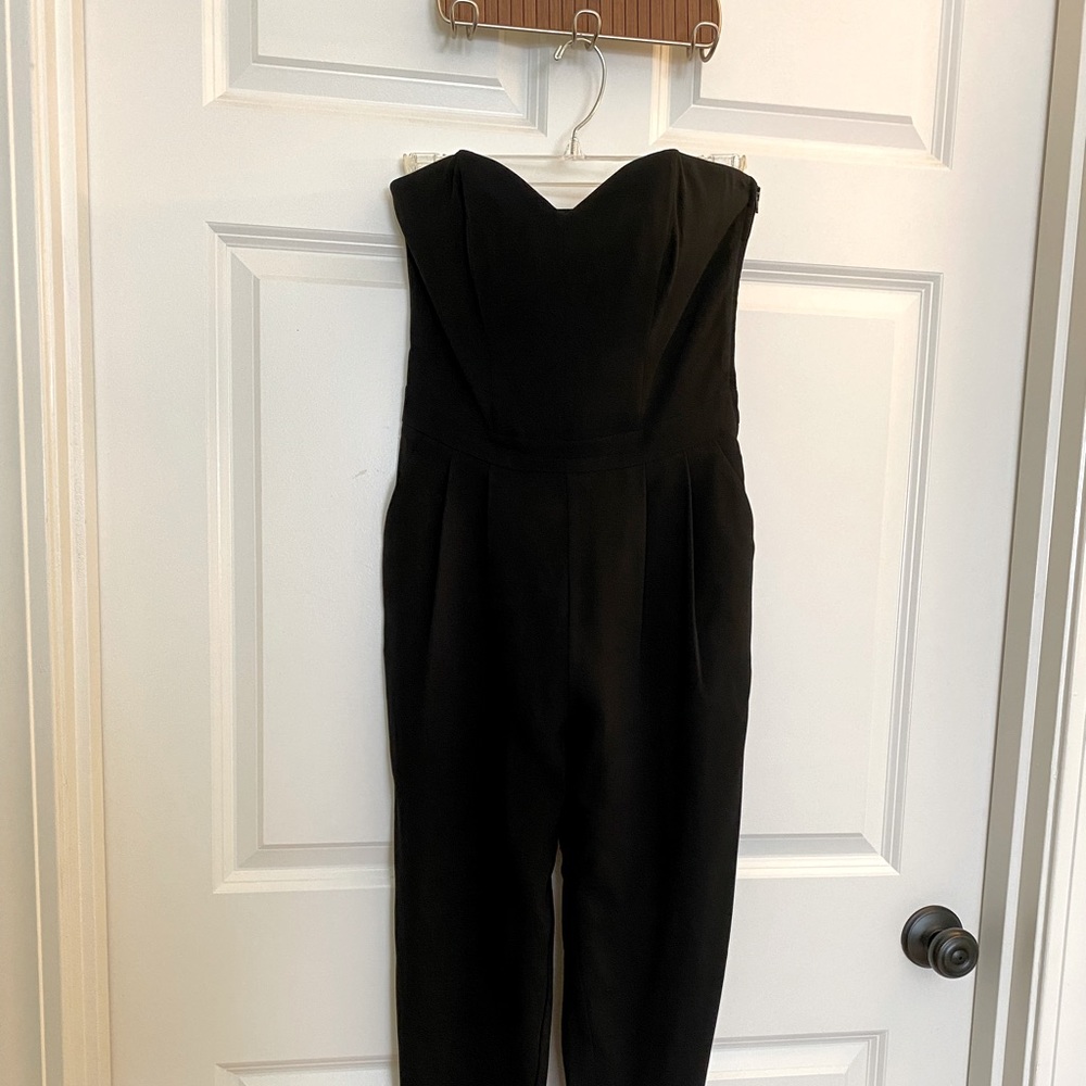 Black strapless jumpsuit with pockets